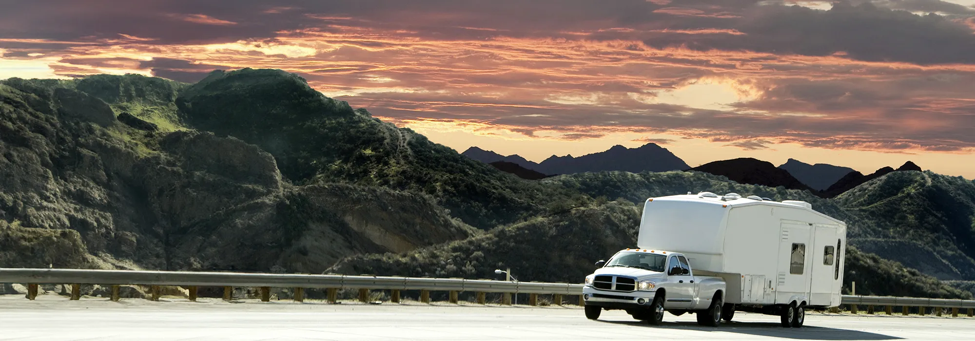 Truck with travel trailer on highway