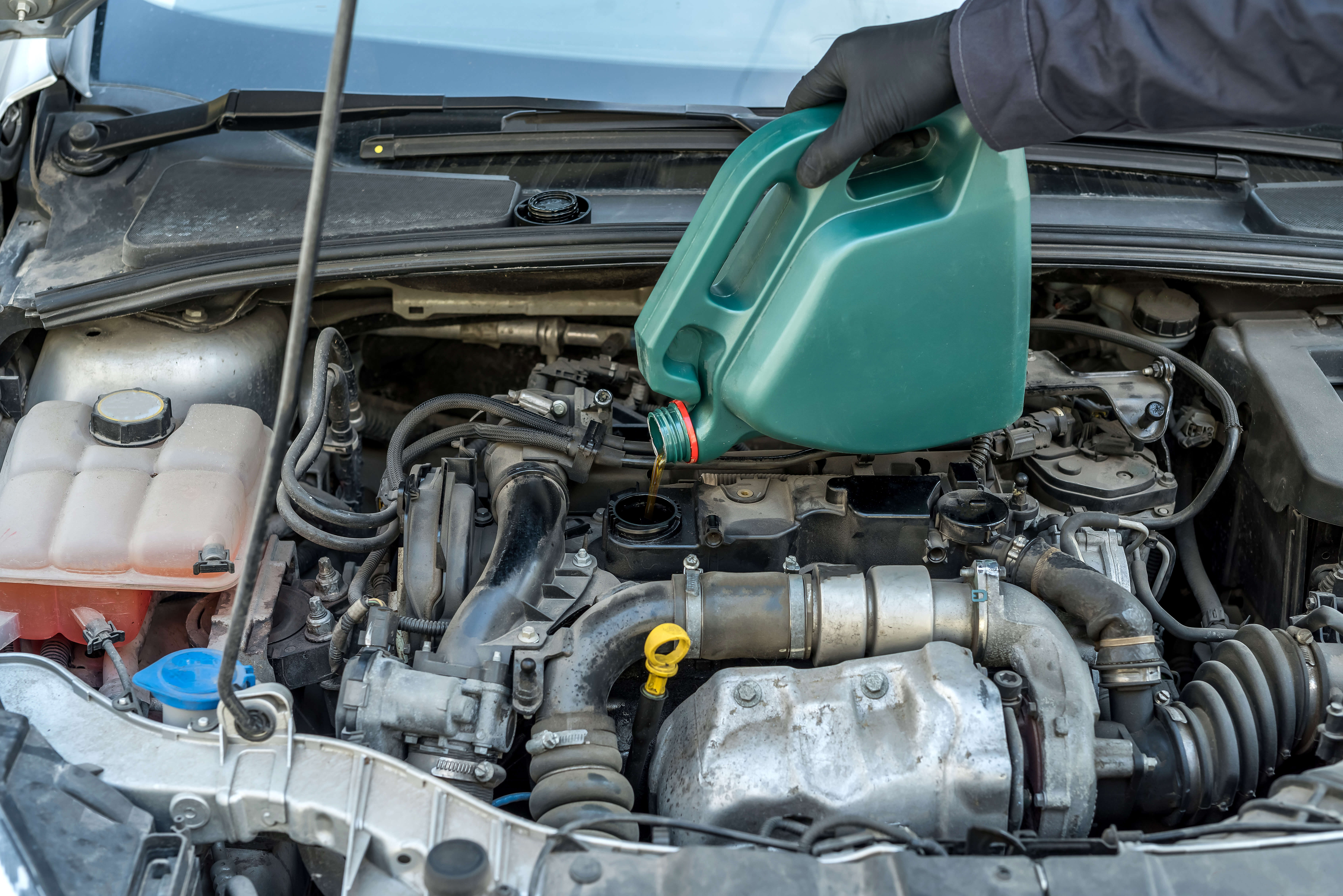 Pouring oil to engine