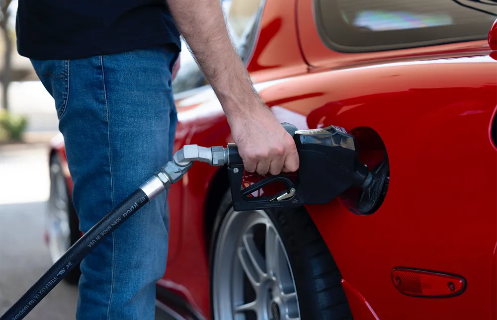 Sports car filling up at Sunoco station