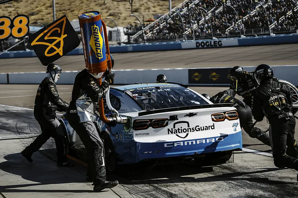 Sunoco pit crew with Sunoco fuel