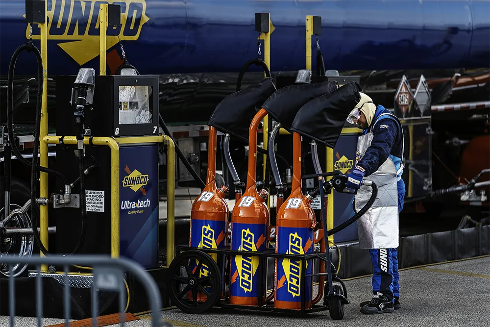 Sunoco fuel cans and crew at pit stop