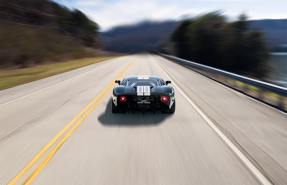 Car driving fast on highway